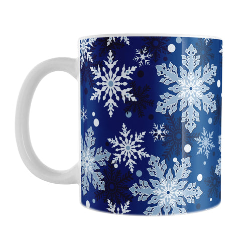 Classic Blue Snowflake Pattern Winter Mug (11oz) at Amy's Coffee Mugs. A ceramic coffee mug designed with a pattern of different shades of blue snowflakes over a classic blue background color that wraps around the mug.